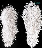 Lightweight white volcanic perlite granules mixed with dark potting soil.