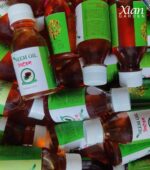 Mixing a DIY Neem Oil Care spray for plants.